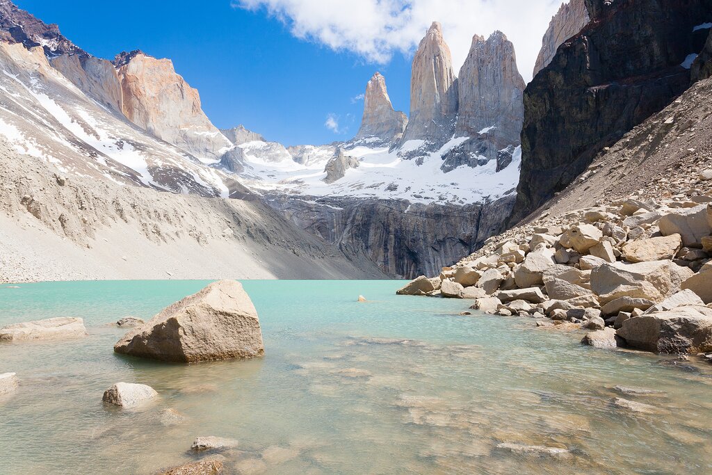 A boat crossing a glacial lake in Patagonia